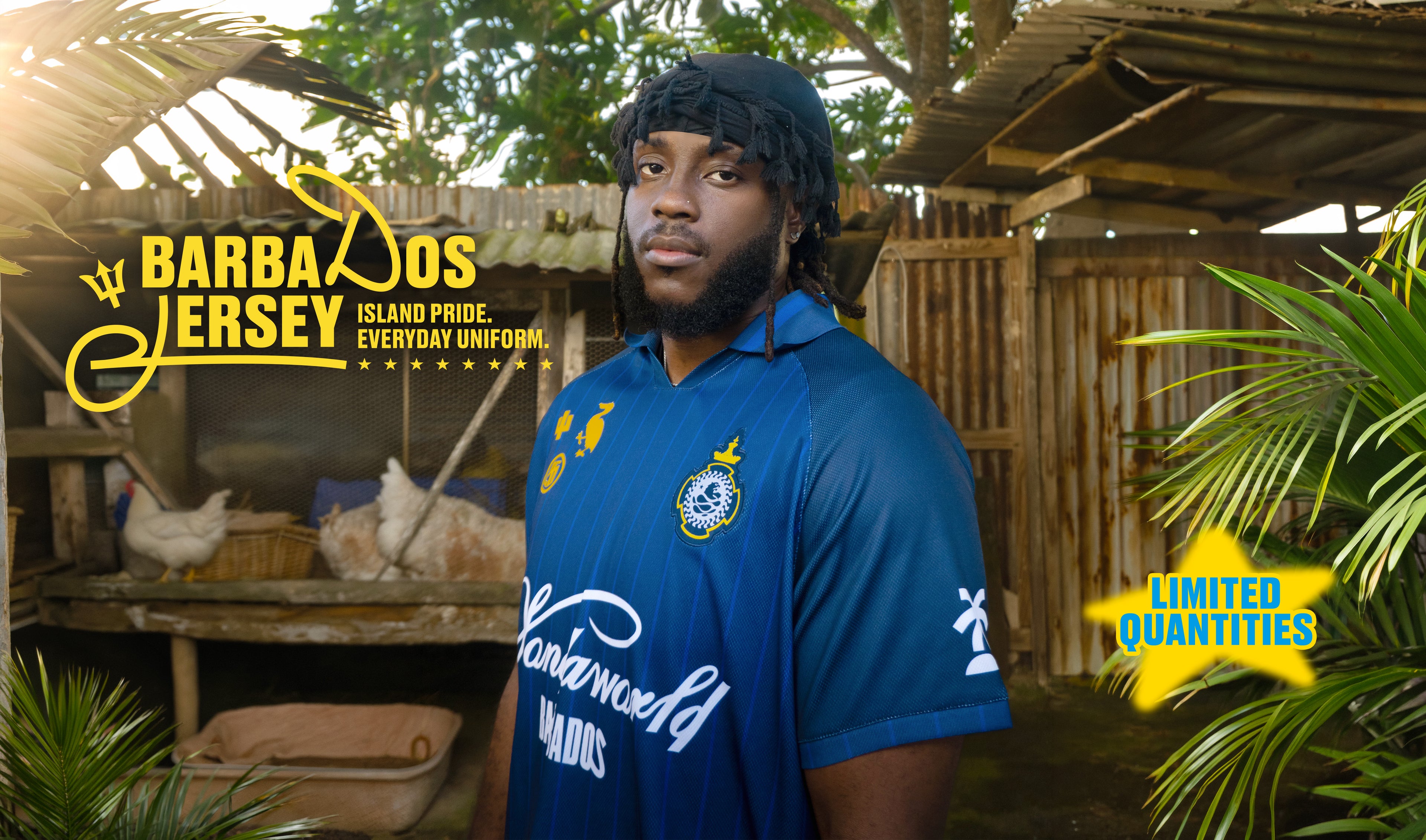 Person wearing a blue jersey with branding in a tropical setting